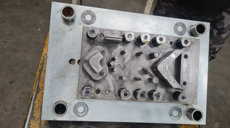 Toolmaker working on press tooling